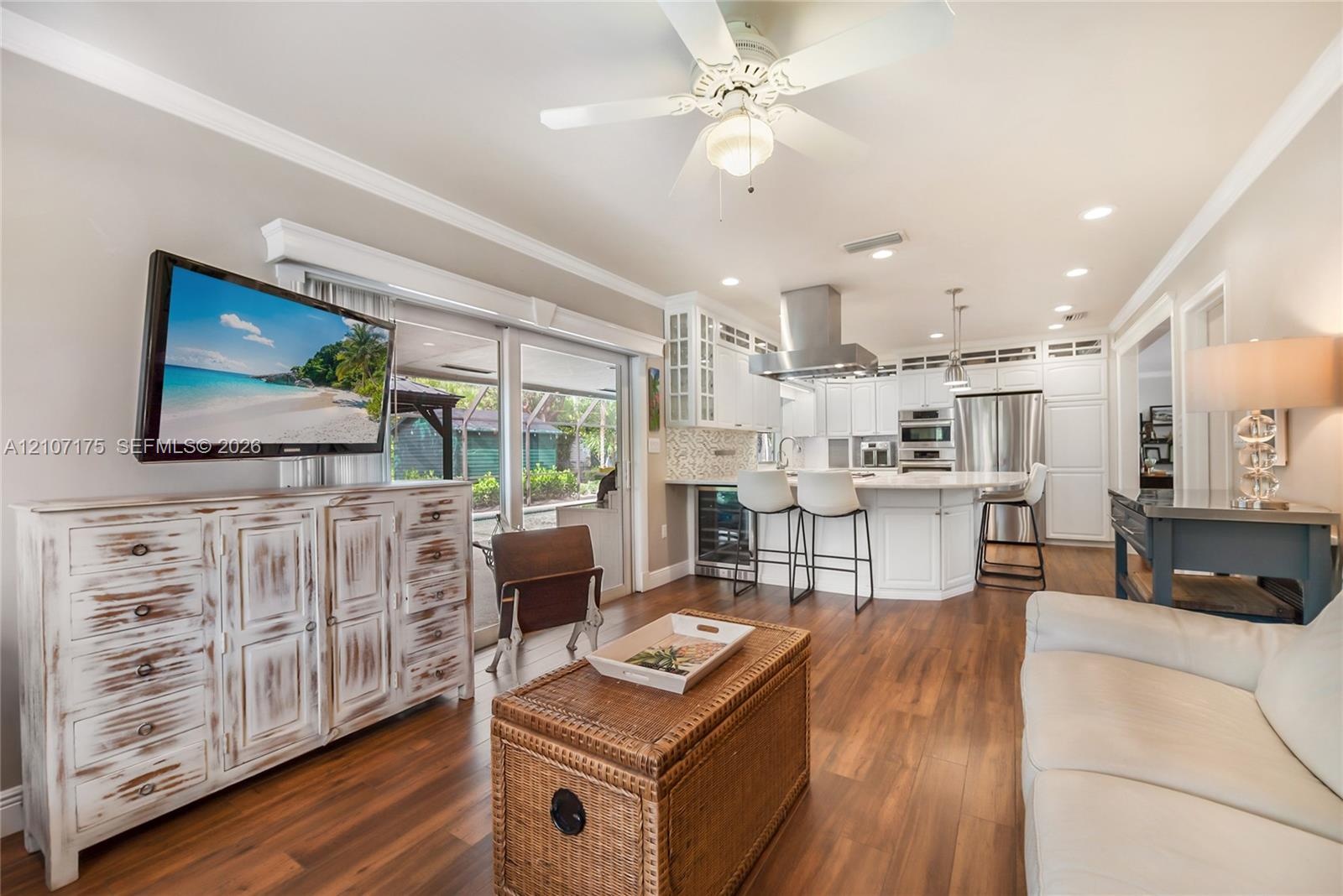 Open-concept kitchen family room with built-in wine cooler.