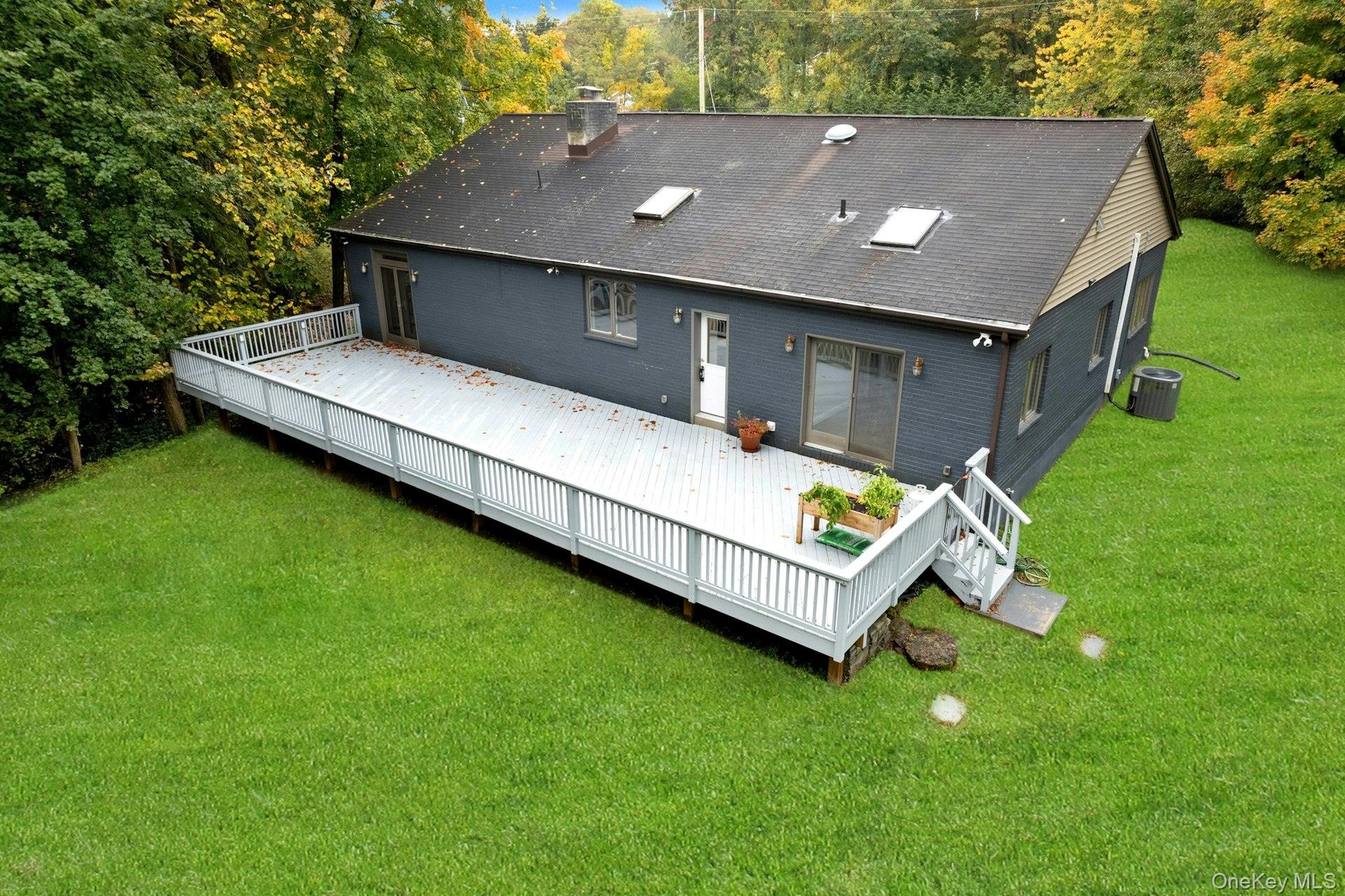Oversized deck with yard access.