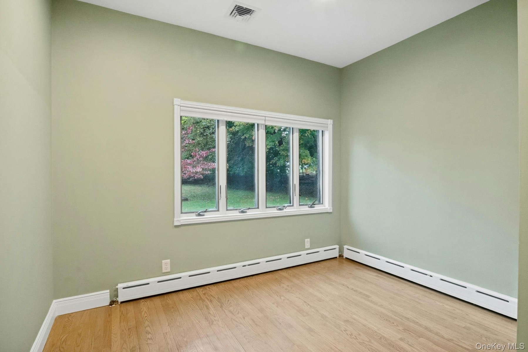 Bedroom #2 with large windows.