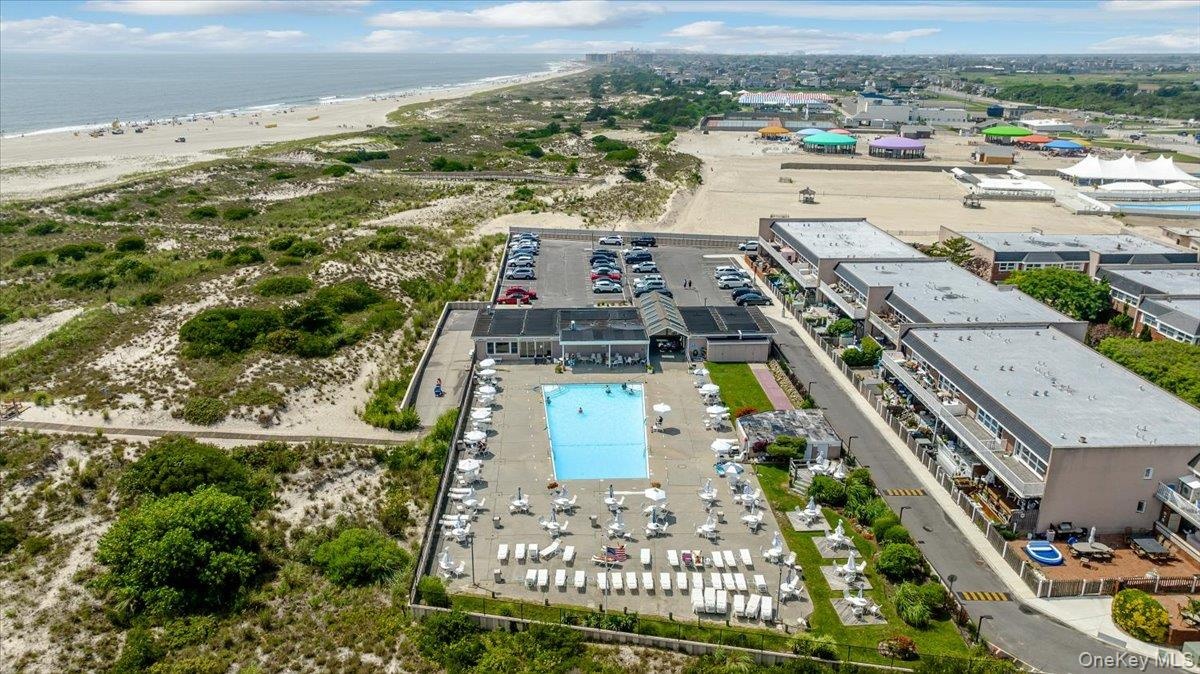 Bird's eye view with a water view and a beach view