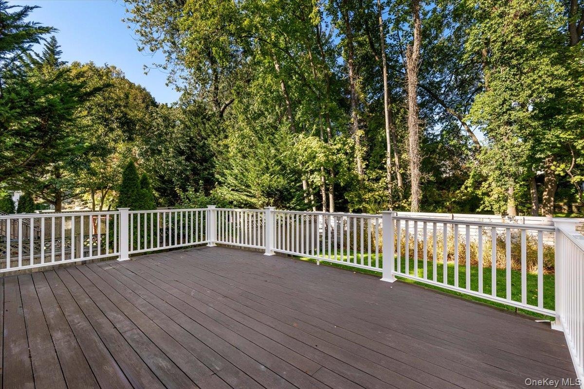Large deck for easy flow and entertaining located off the family/ kitchen area. Easy to grill, sit and relax.