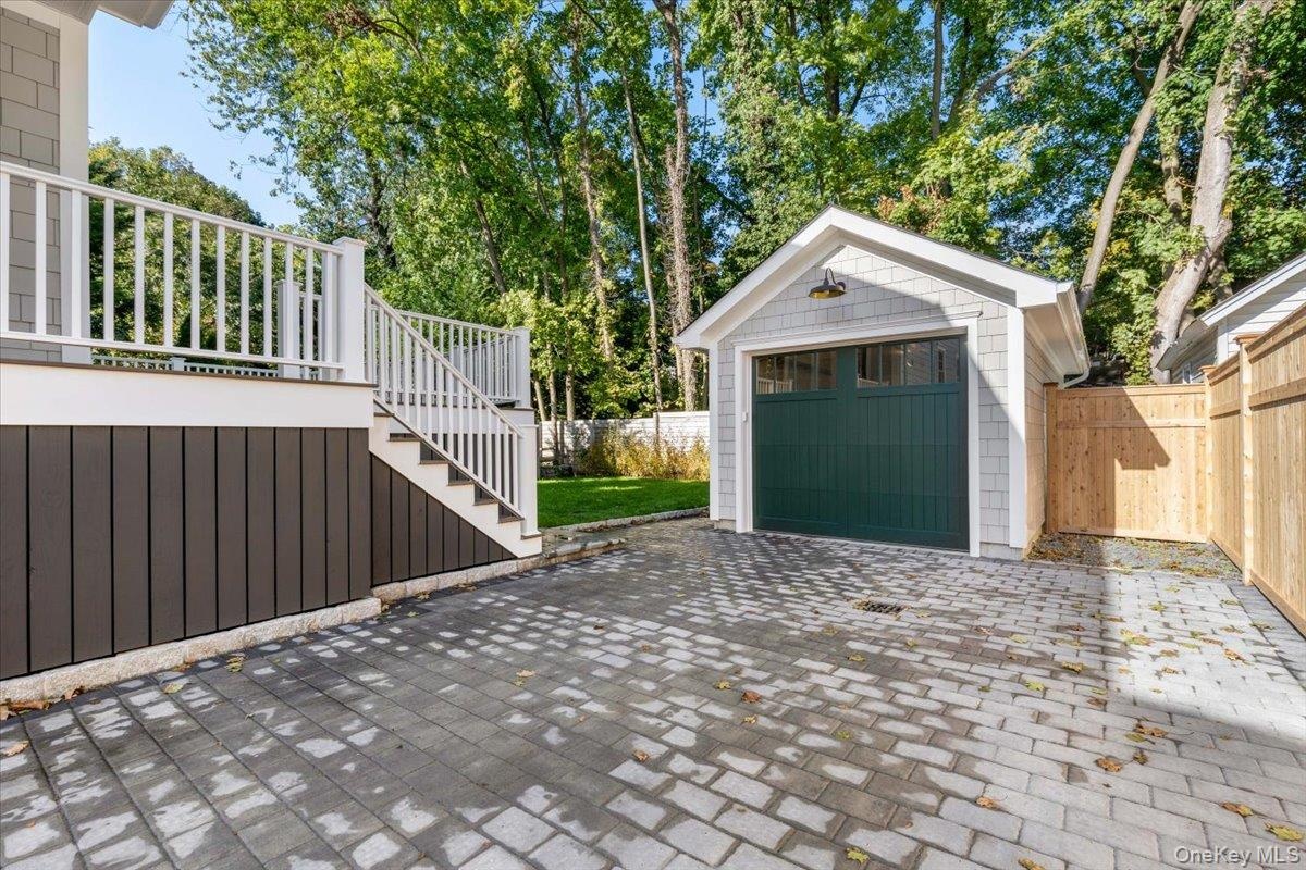 Aesthetic elements to  provide custom features- from the tall wood fence for privacy, pavers to distinguish additional space in yard (pleasing to the 