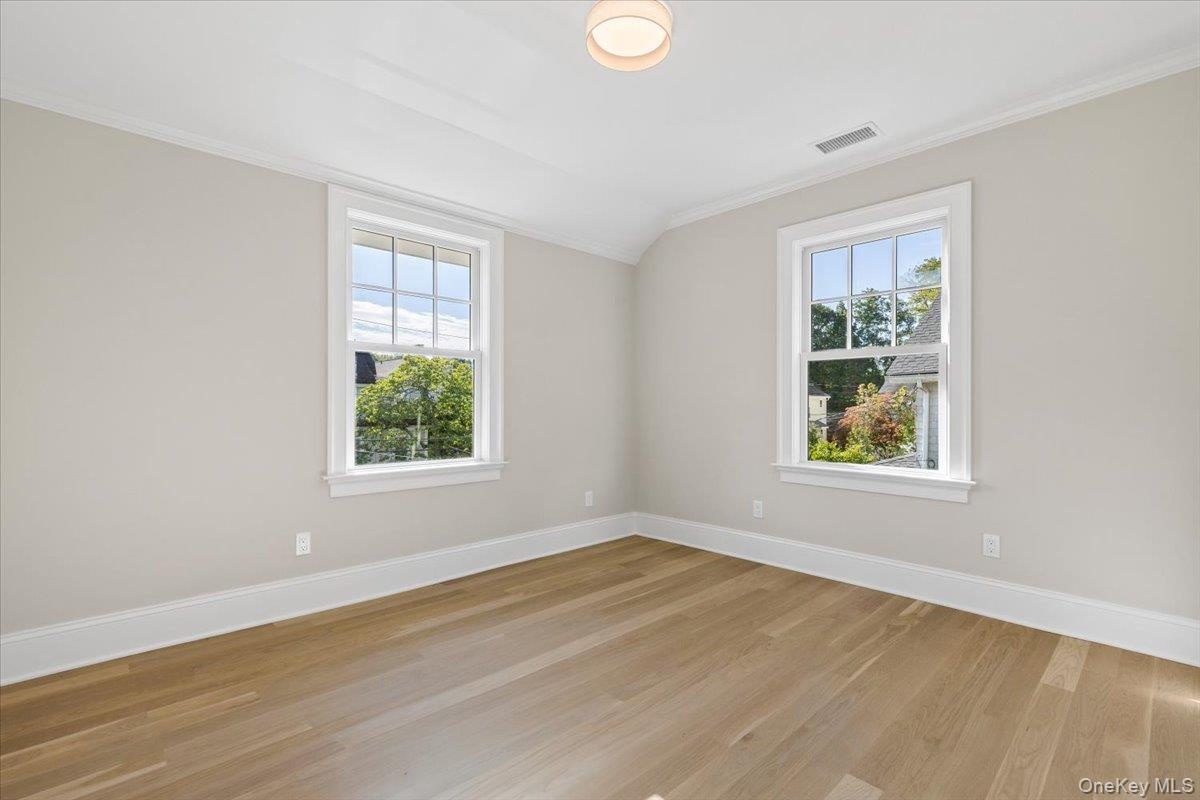 Second floor bedroom with custom fitted closet.