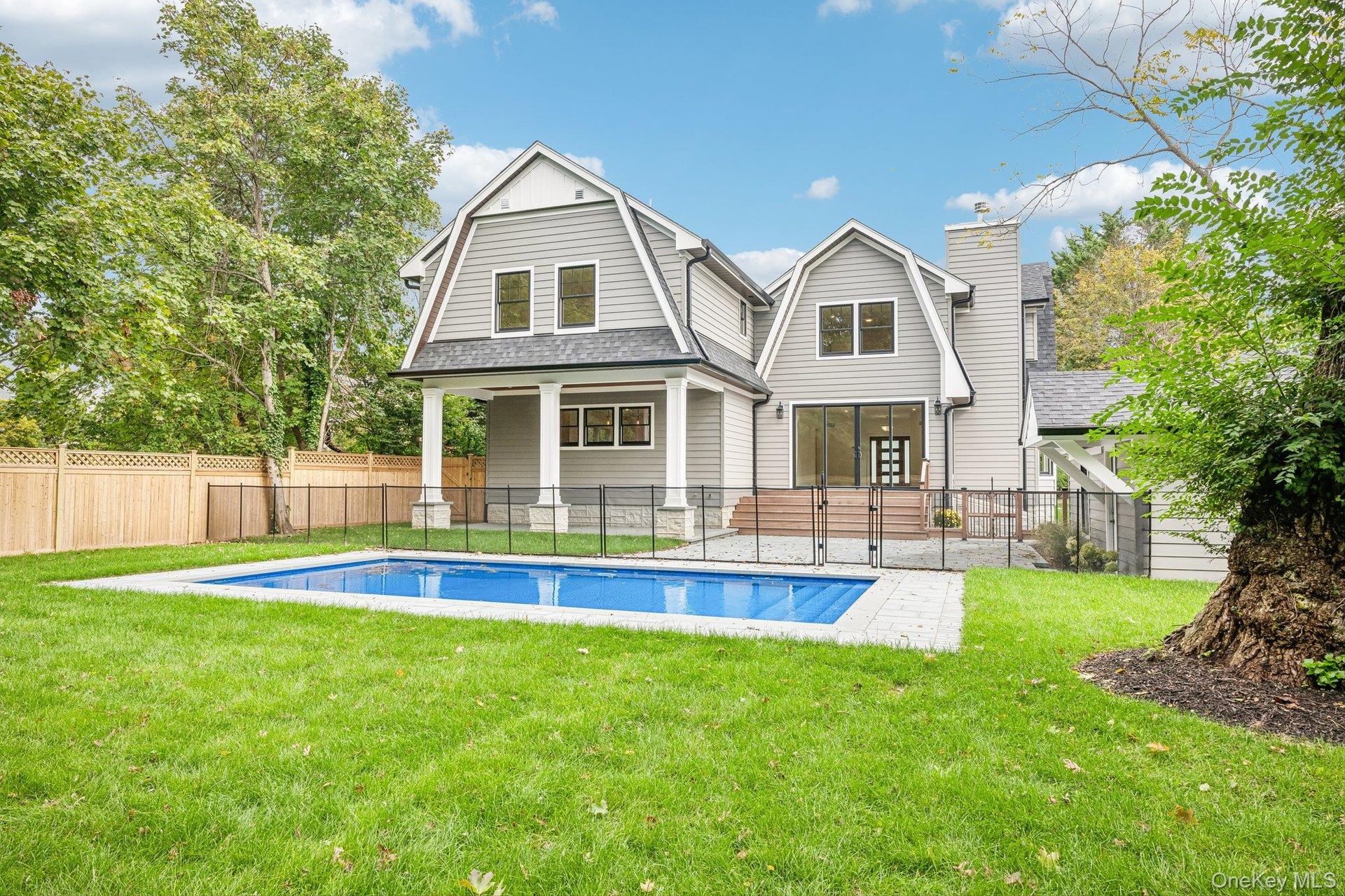 A 0.31-acre setting of new lawn, pool and patio, already green. For a night out, Buoy 35's sunset deck on the Blue Point Marina is about 0.7 miles awa