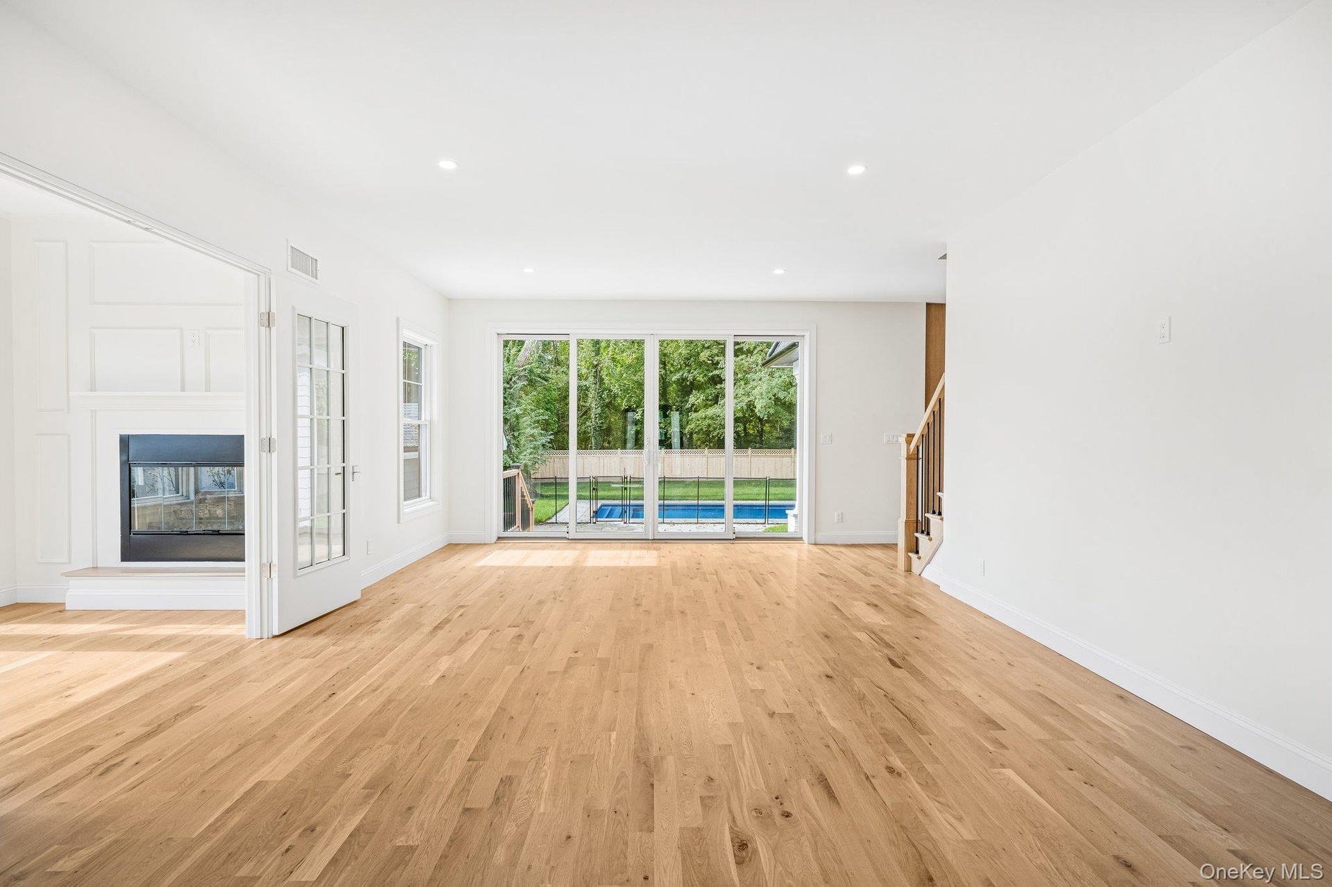 Glass sliders frame the saltwater pool. When you'd rather see open water, the Blue Point Dock at Blue Point Avenue and Grandview Drive, less than half