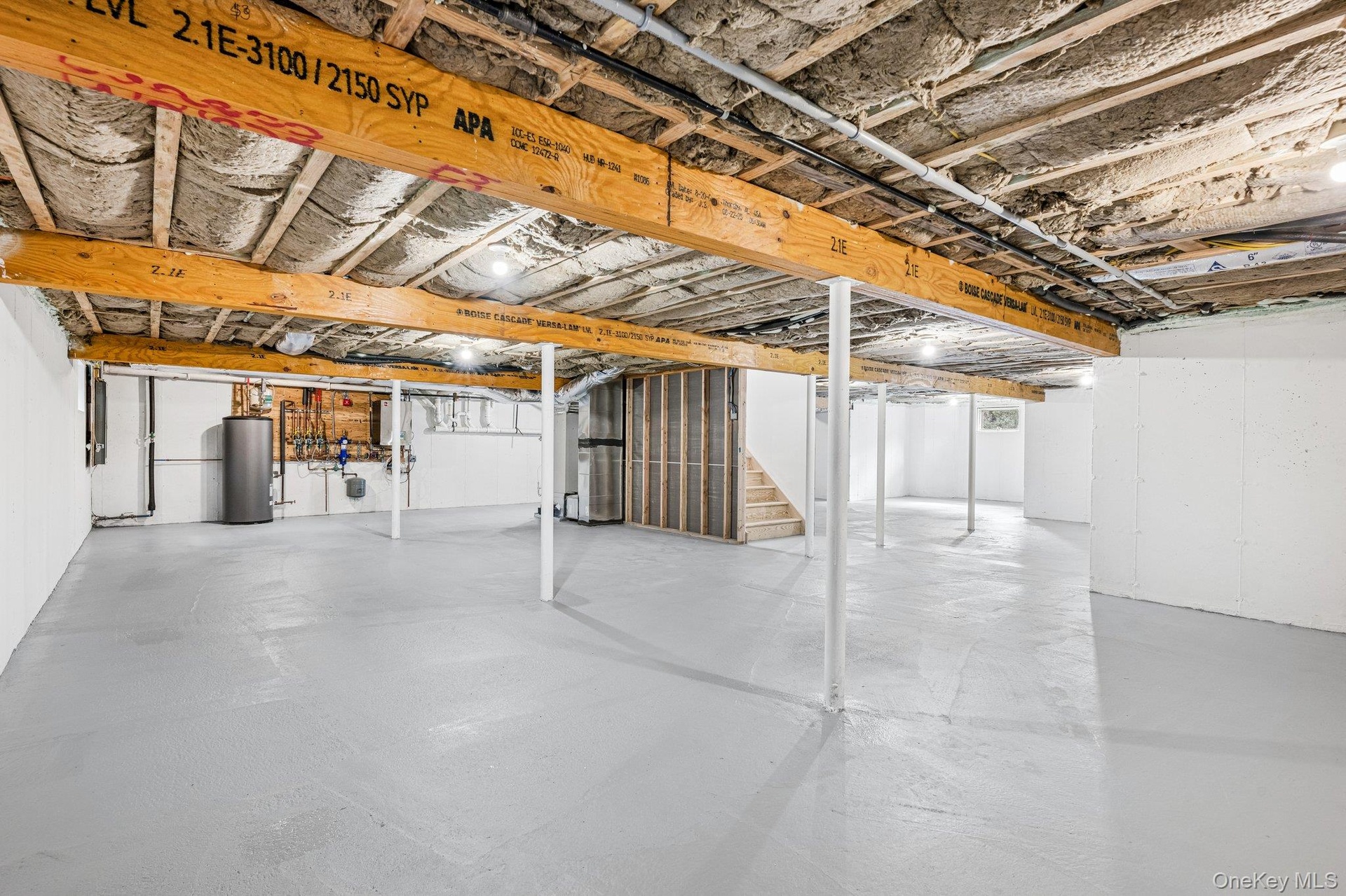 An expansive lower level with a high-efficiency boiler and two heating and cooling zones. Room for paddleboards and beach gear, with the Blue Point Do