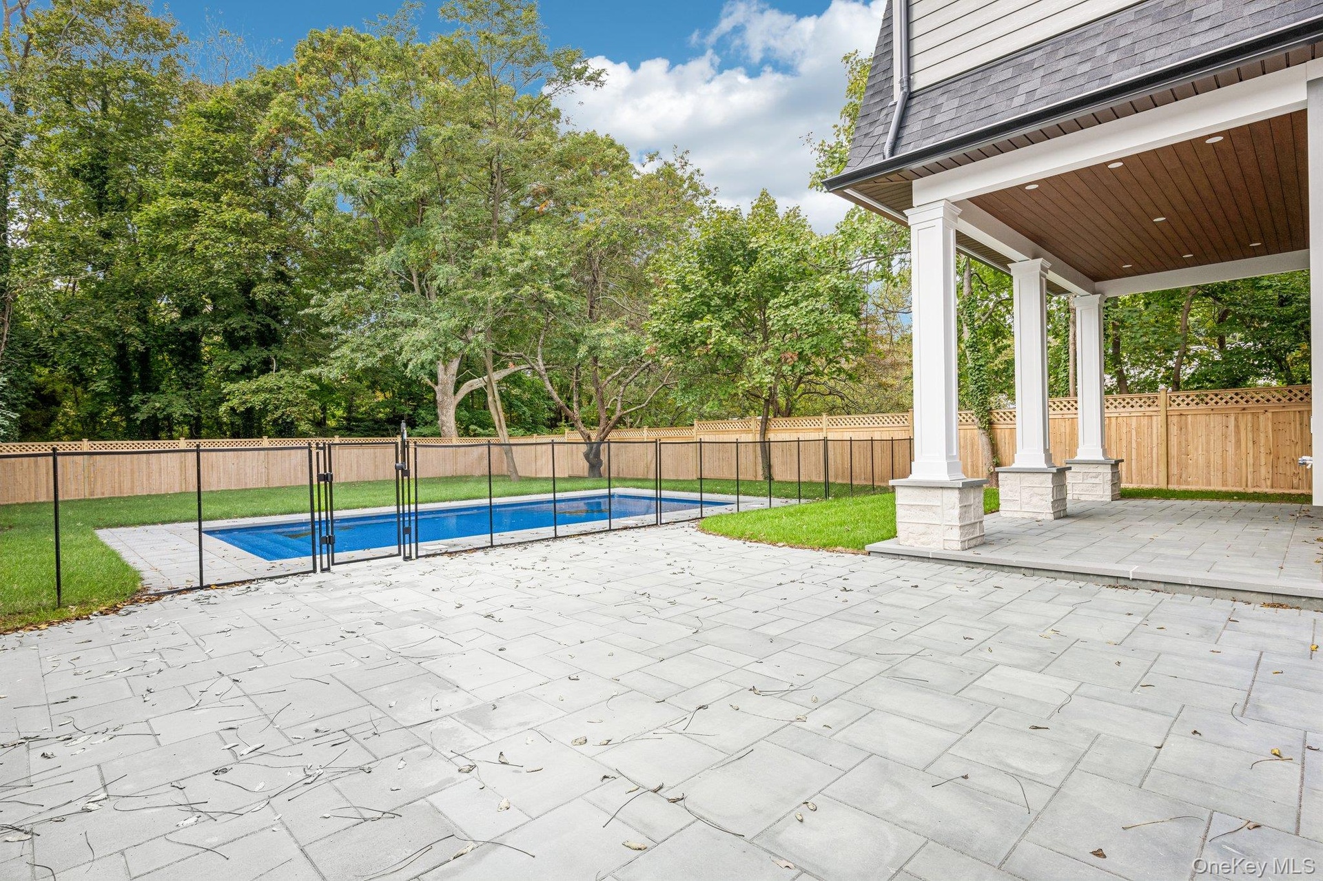 A covered rear porch overlooking the pool, an outdoor room for every season. For an evening out, Stella Trattoria on Montauk Highway is about five min
