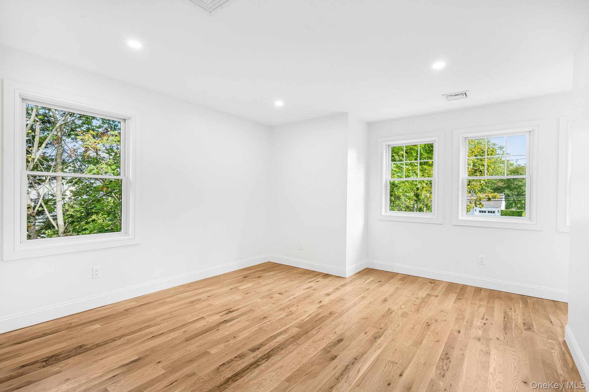 Corner windows bring treetop light into this bedroom. Each summer, a free DEC fishing and crabbing evening at the Corey Beach Pier, about 0.7 miles aw