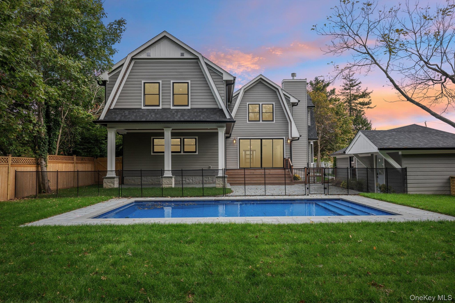 Twilight over the pool at 10 Nelson Avenue. The town's namesake beer is poured close by, at the Blue Point Brewing tasting room on West Main Street in