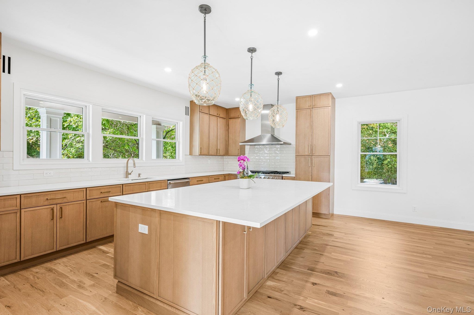 Morning light pours across the island. Coffee in hand, stroll to the Blue Point Nature Preserve at the end of Nelson Avenue: 20 acres of meadow, a per