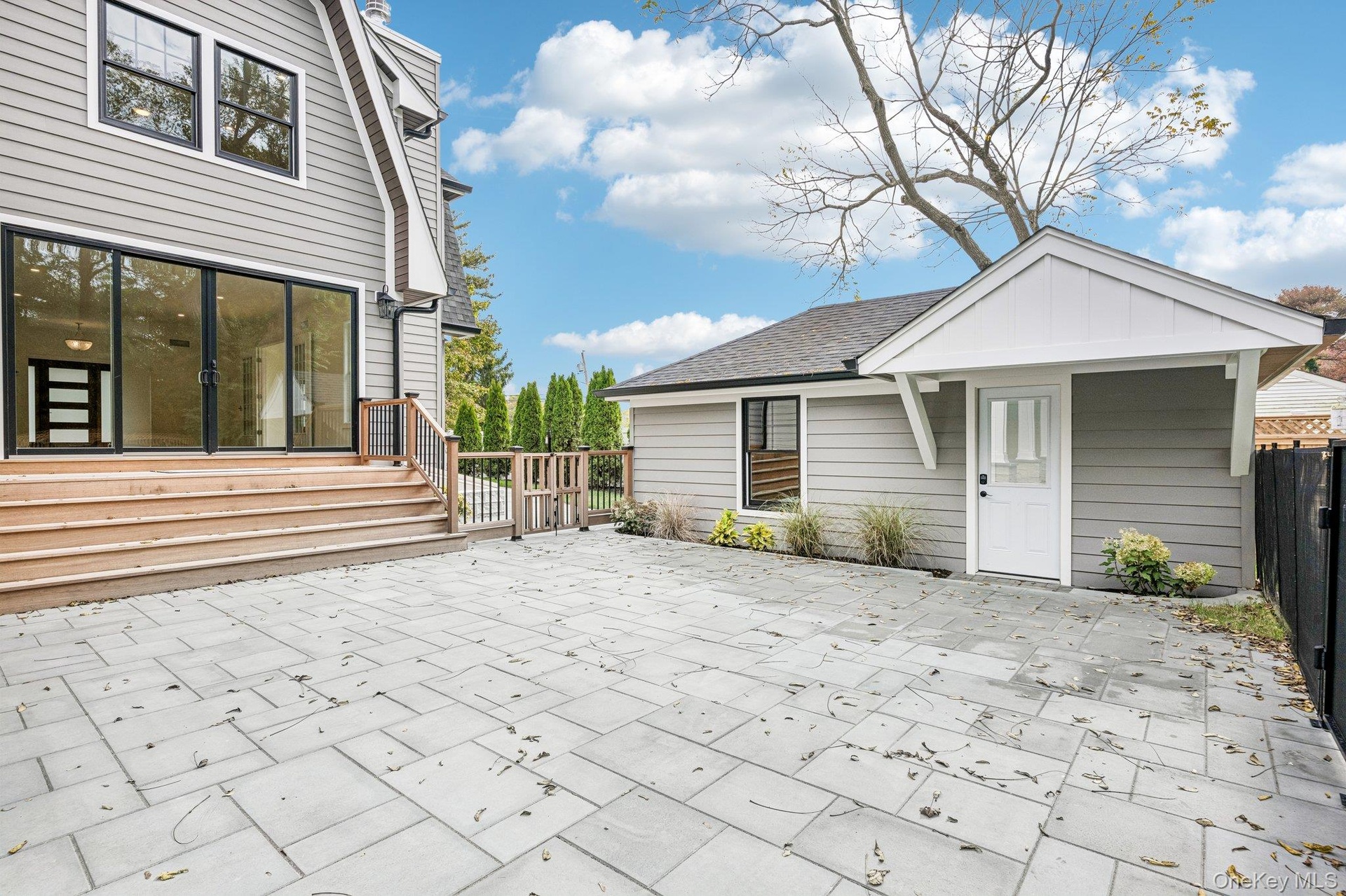 A paver patio and mahogany rear deck for evenings al fresco. Fill the planters from Bayport Flower Houses on Montauk Highway, a short drive west.