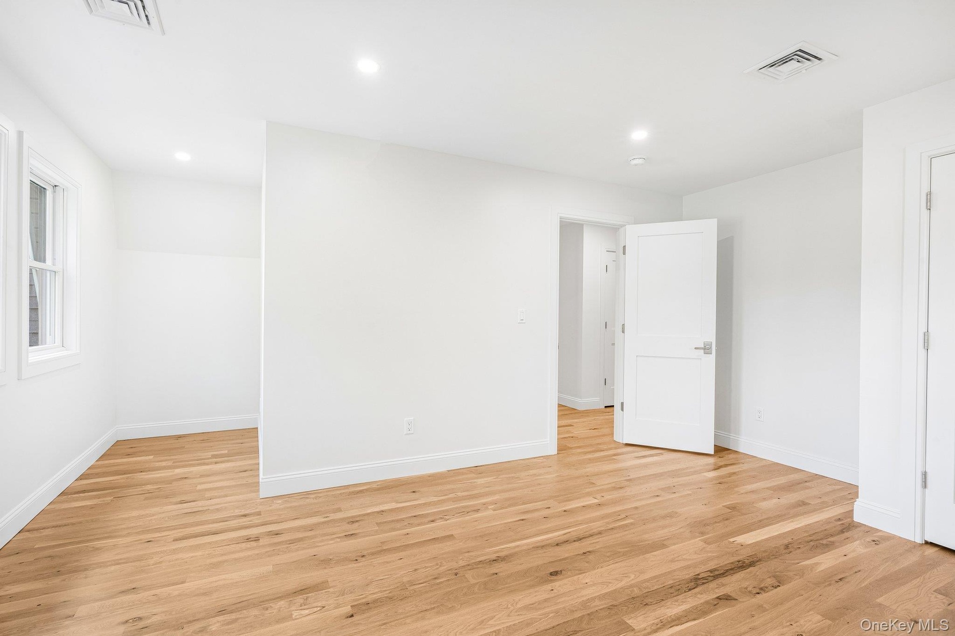 A quiet, well-proportioned bedroom. Little ones love the fenced playground at Corey North Park by the Blue Point Marina, then a snow cone at Beach Sid