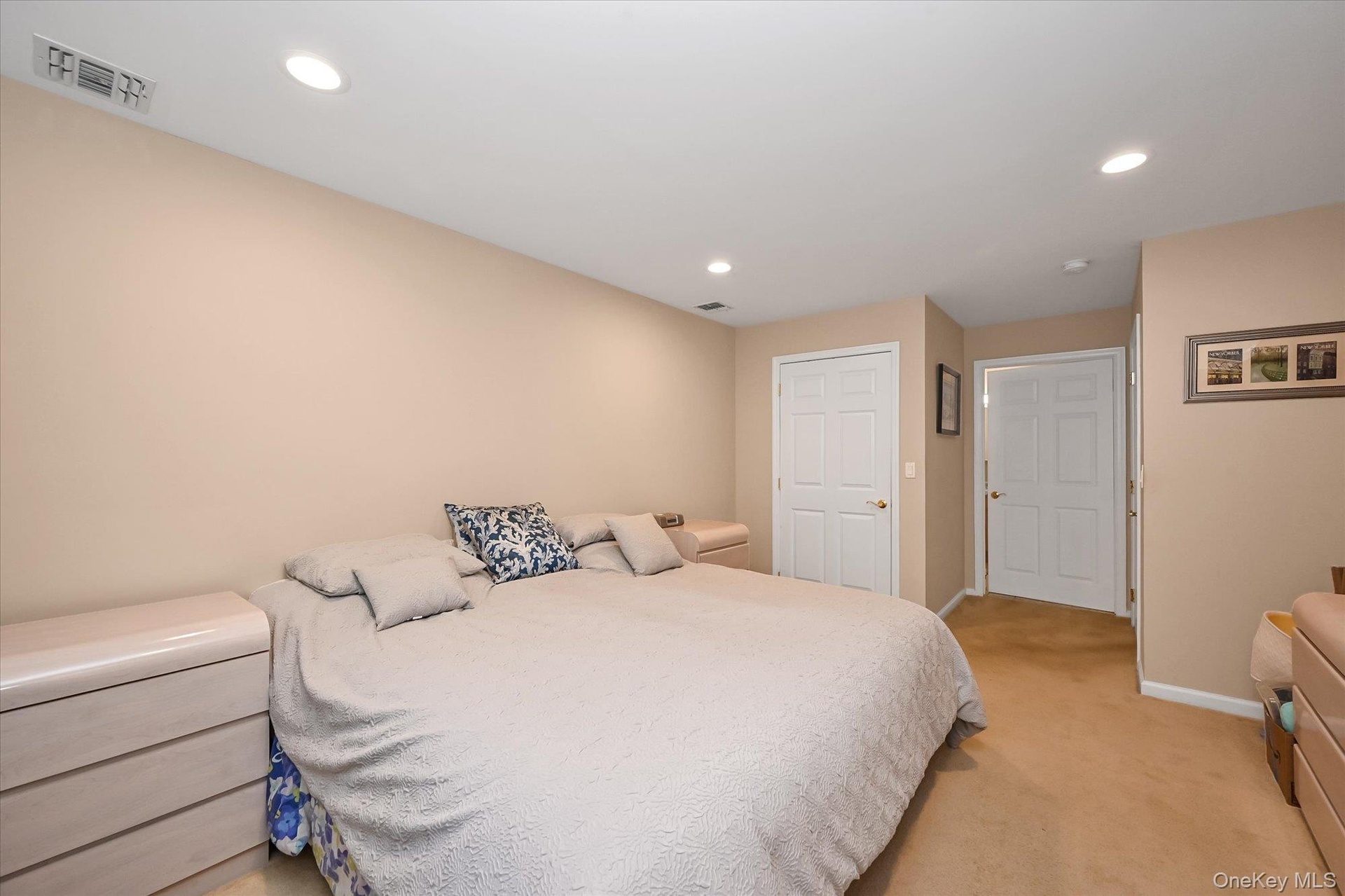 Large primary bedroom easily fits a king size bed