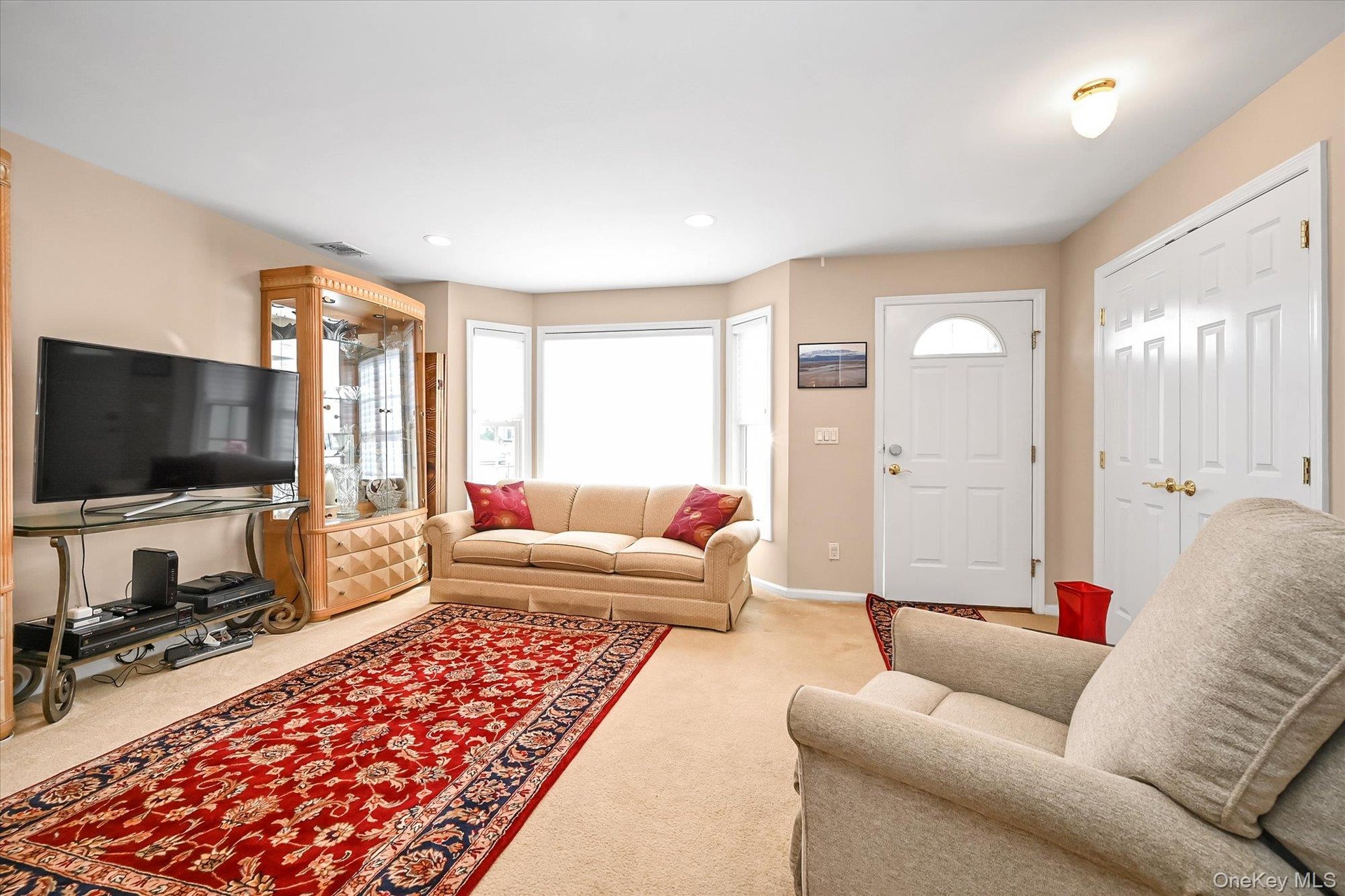 Natural sunlight bathes this living room. Great for entertaining or a quiet evening at home