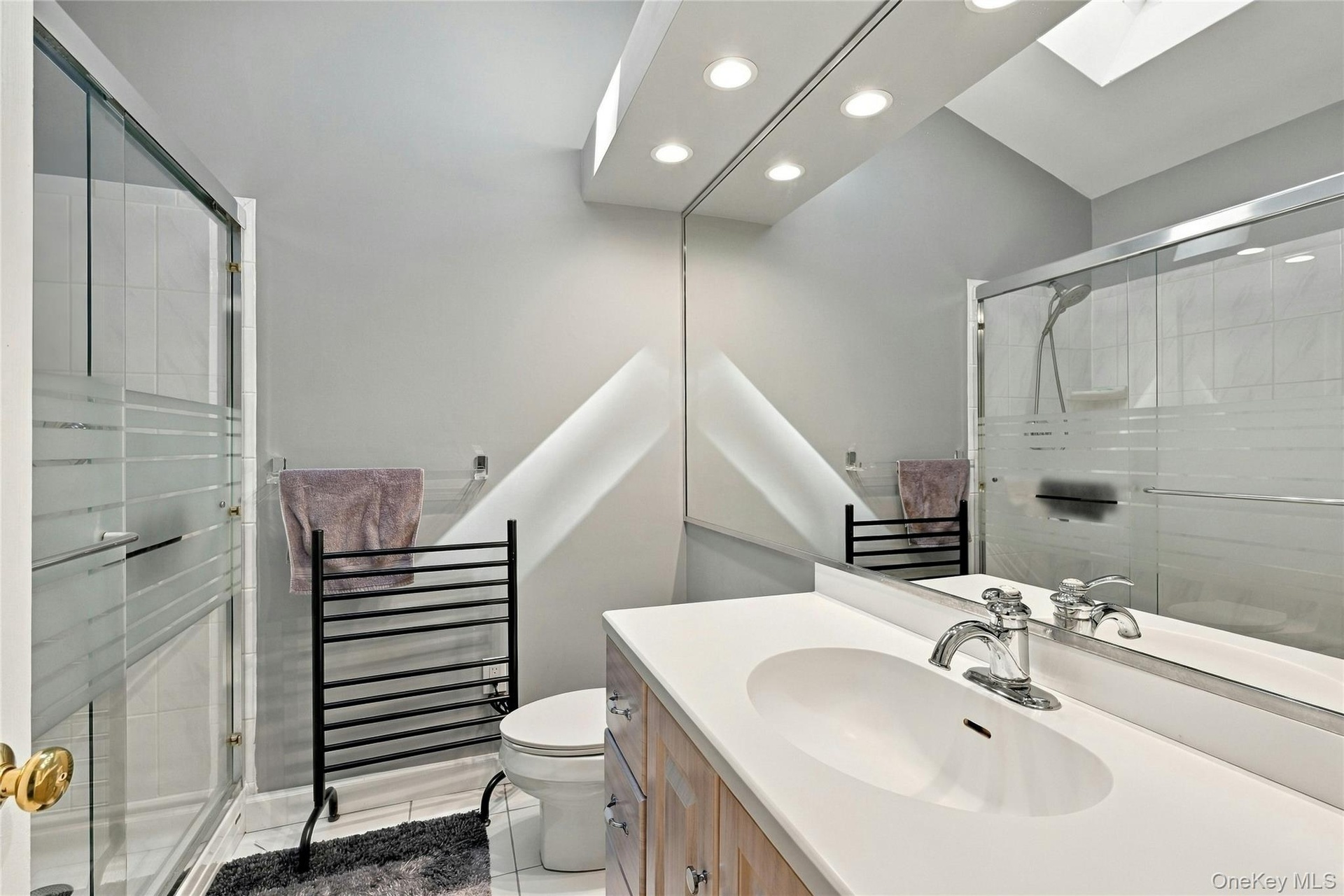 Ensuite Bathroom with walk in shower and skylight 7 x 6 sq ft