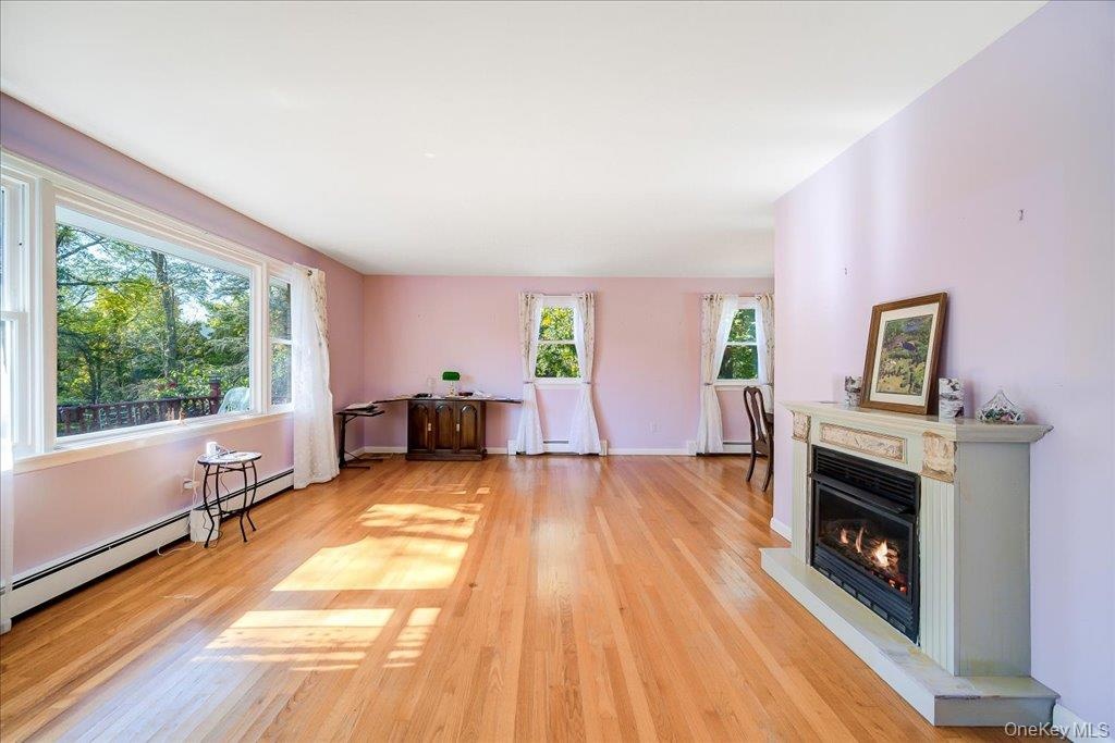 Step inside to the front living room with fantastic hardwood floors, and sunny bay window!