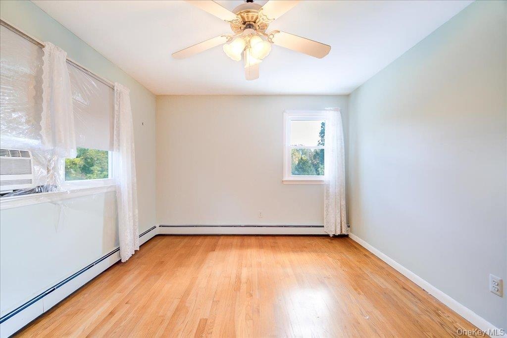 Second of 4 large bedrooms with hardwood floors.