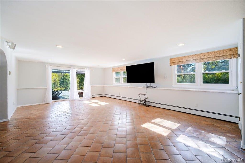 Over-sized light-filled walkout basement den offers plenty of extra living space!
