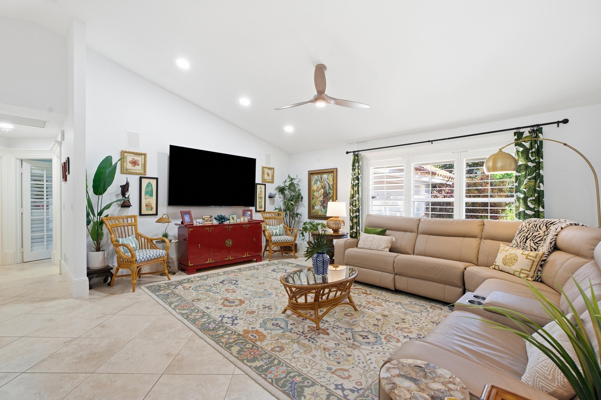 Open-concept living area featuring tile flooring, recessed lighting, and a ceiling fan