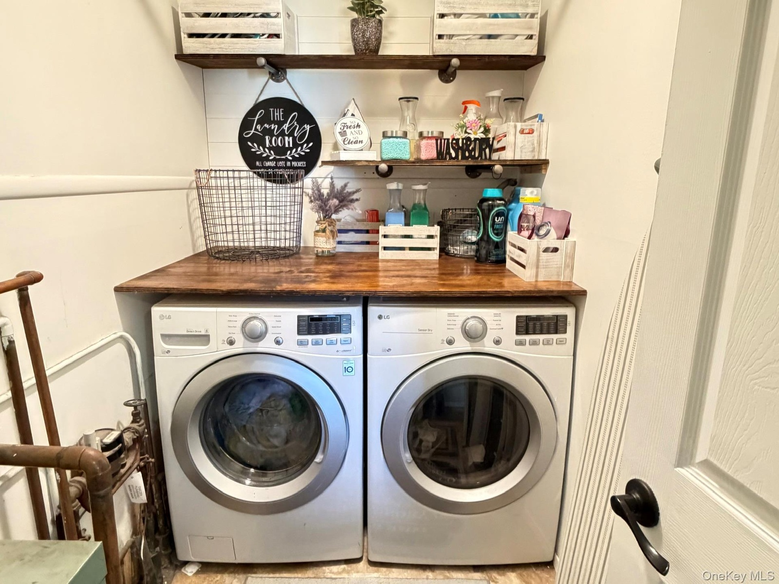 Front-loading washer and dryer units with a wood-finish countertop