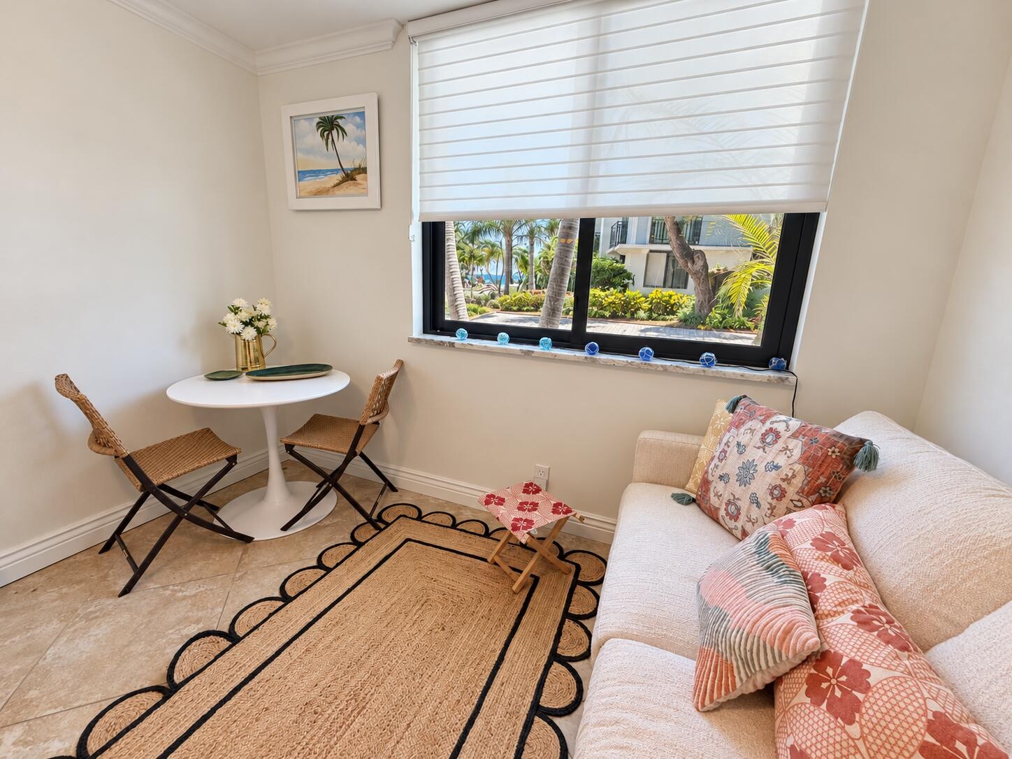 Open bonus area adjacent to the kitchen and near the second bedroom entrance, featuring a sleeper sofa for additional guests.