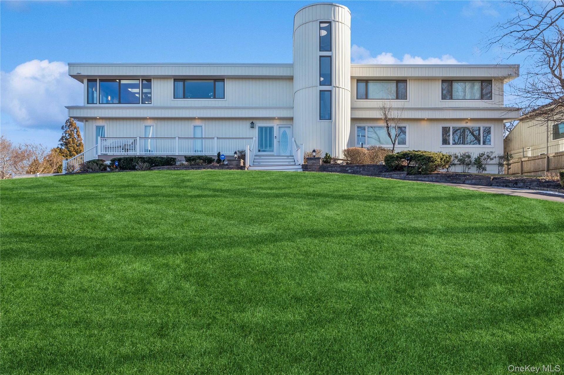 Front of property with a lawn