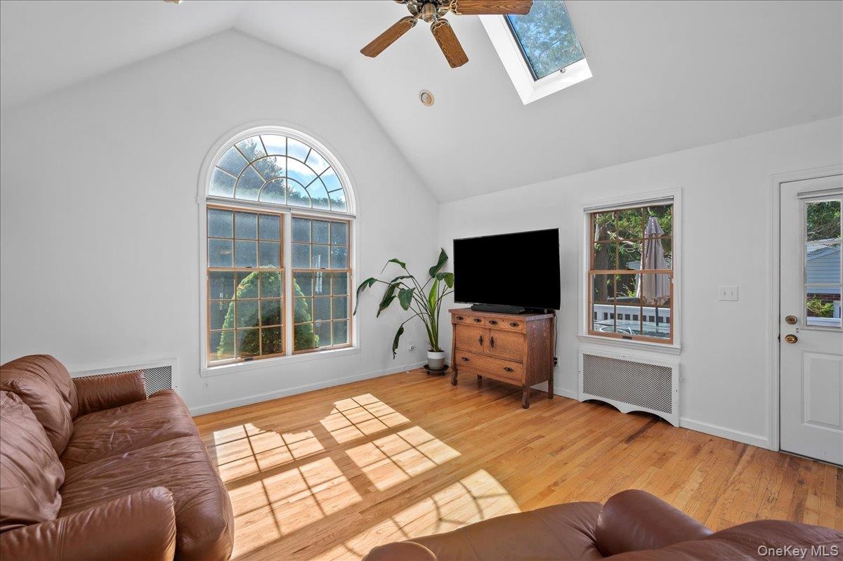 Vaulted ceiling with oversized Palladian windows that overlooks the yard