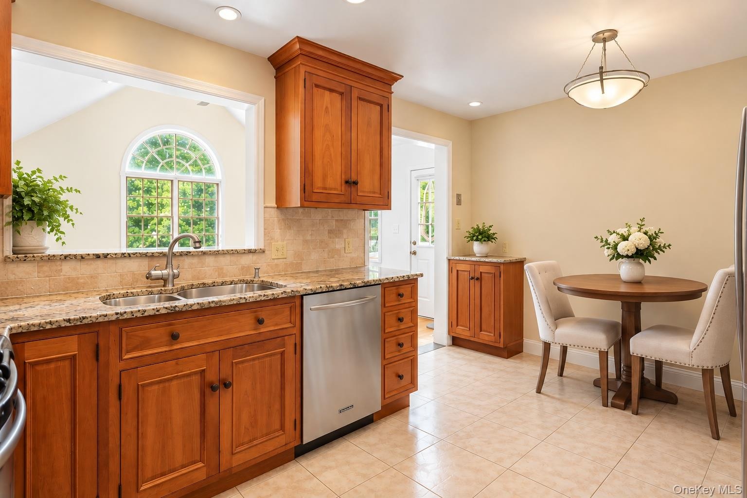 Eat-in-kitchen showing the double sink and breakfast bar.