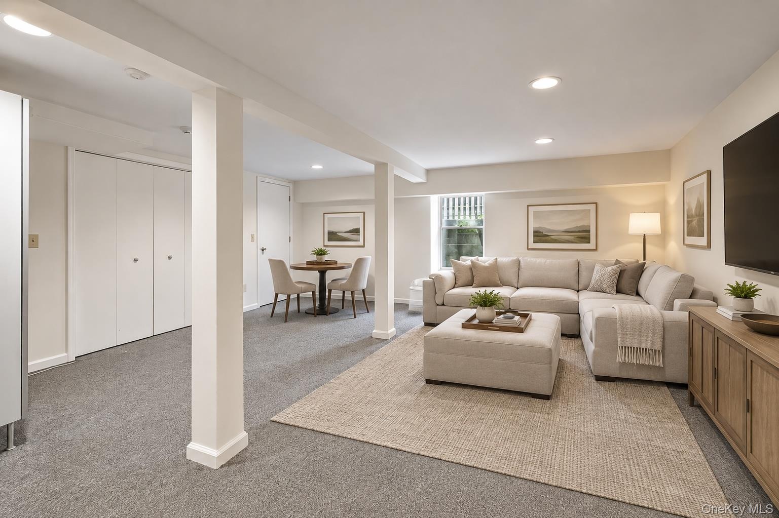 Virtually Staged- Finished recreation room with and egress window