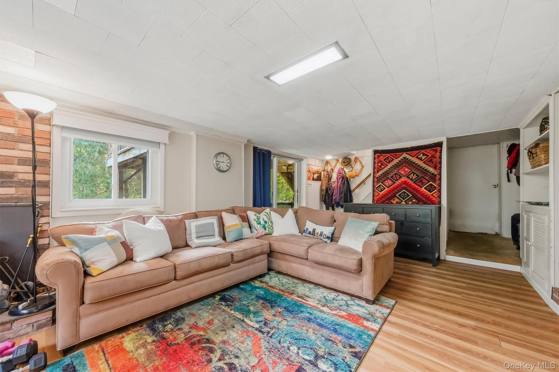 Finished basement with sliding glass doors to backyard.