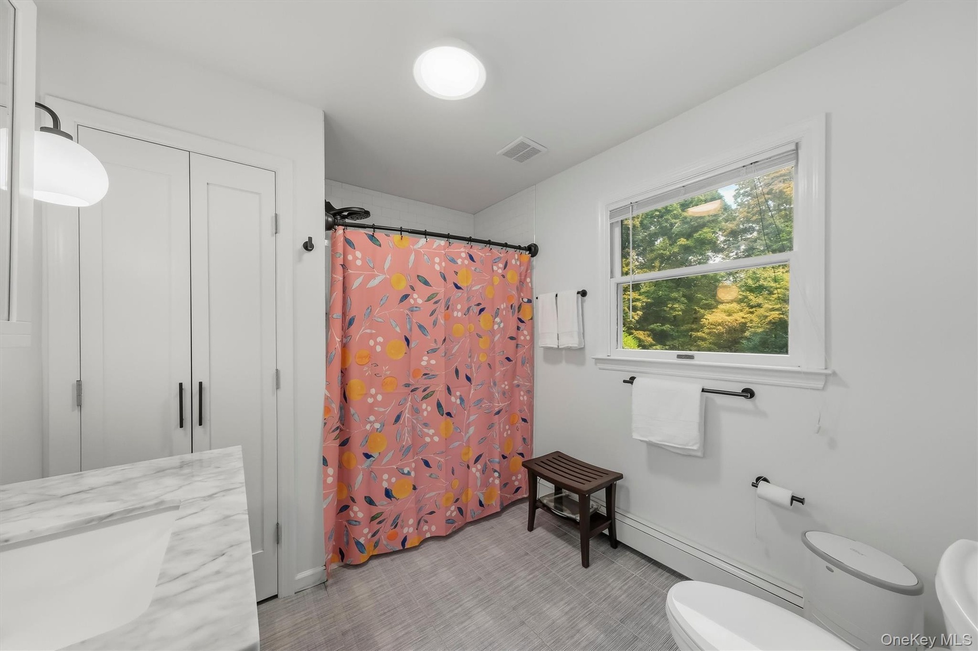 Spacious bathroom with recent renovations.