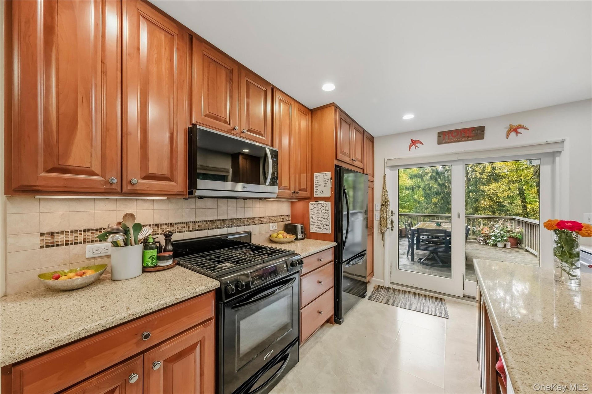 Sliding glass doors open to large deck.