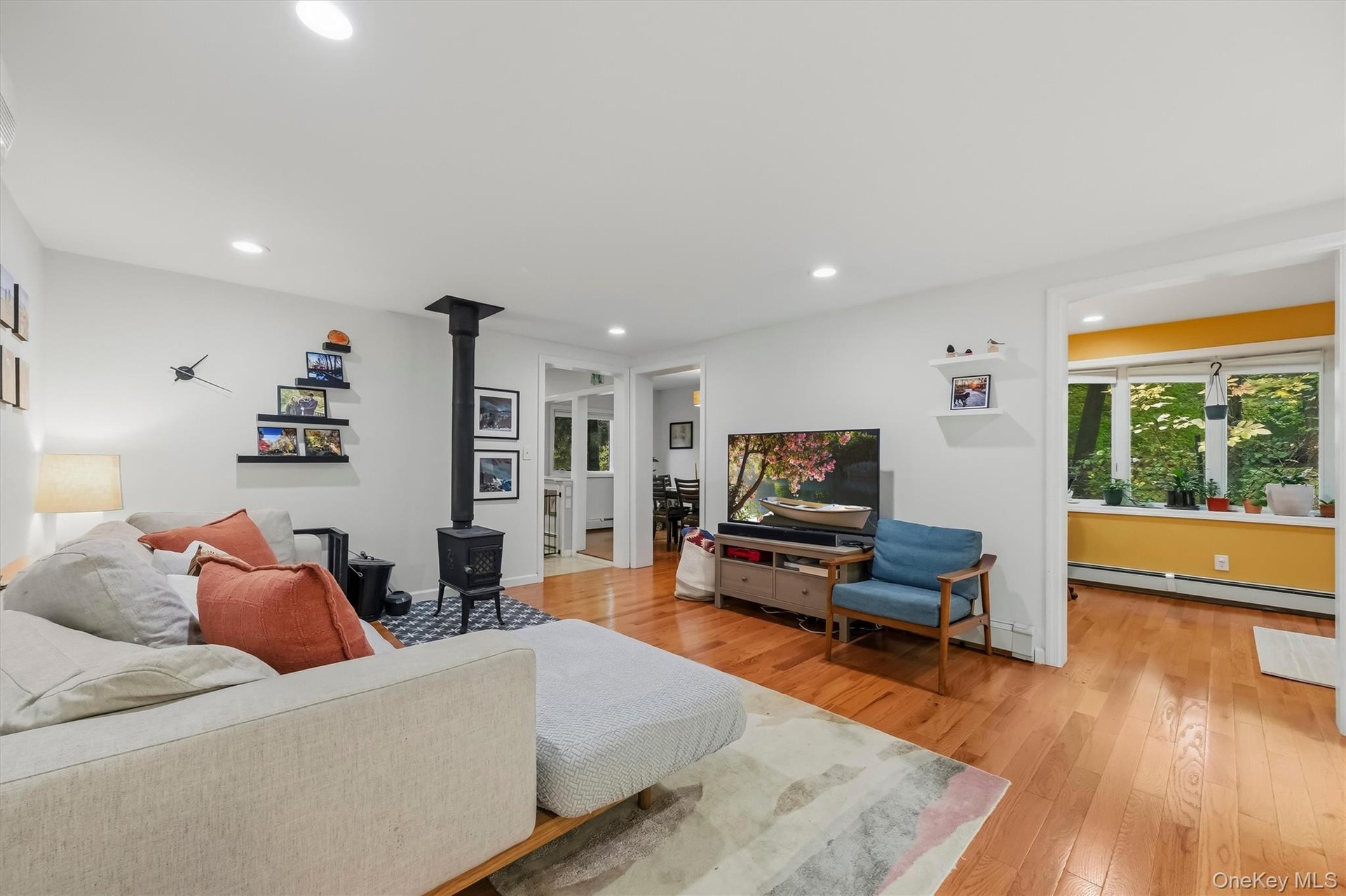 Functional and open floor plan with view from living room to office and dining rooms.