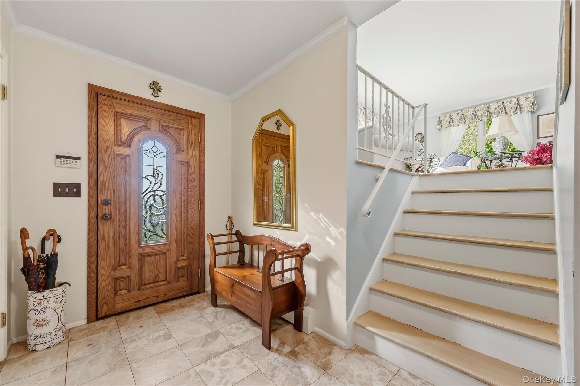 Bright and inviting foyer leading into the home