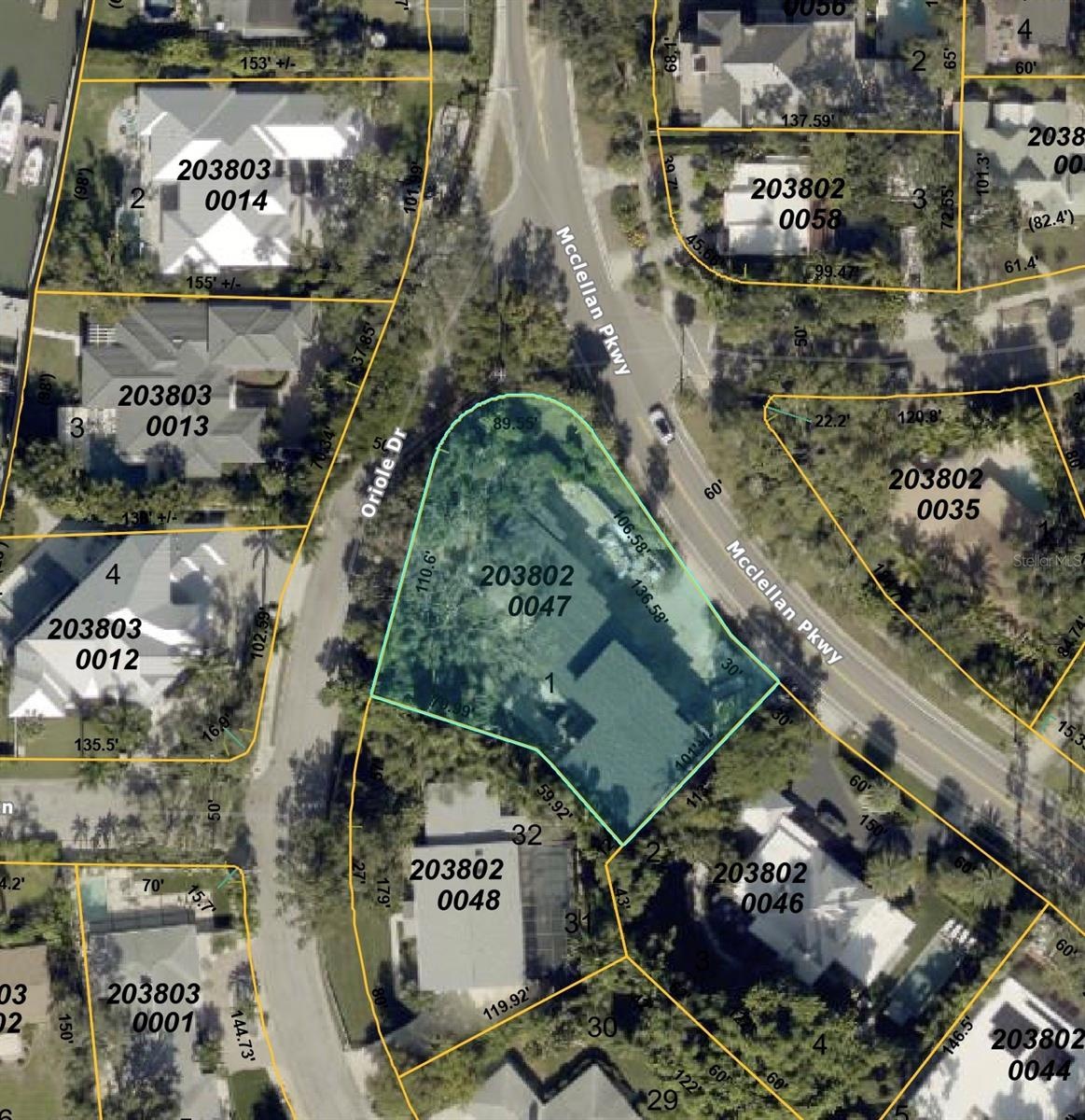 Large lot, with property driveways off McClellan Pkwy and Oriole Dr.
