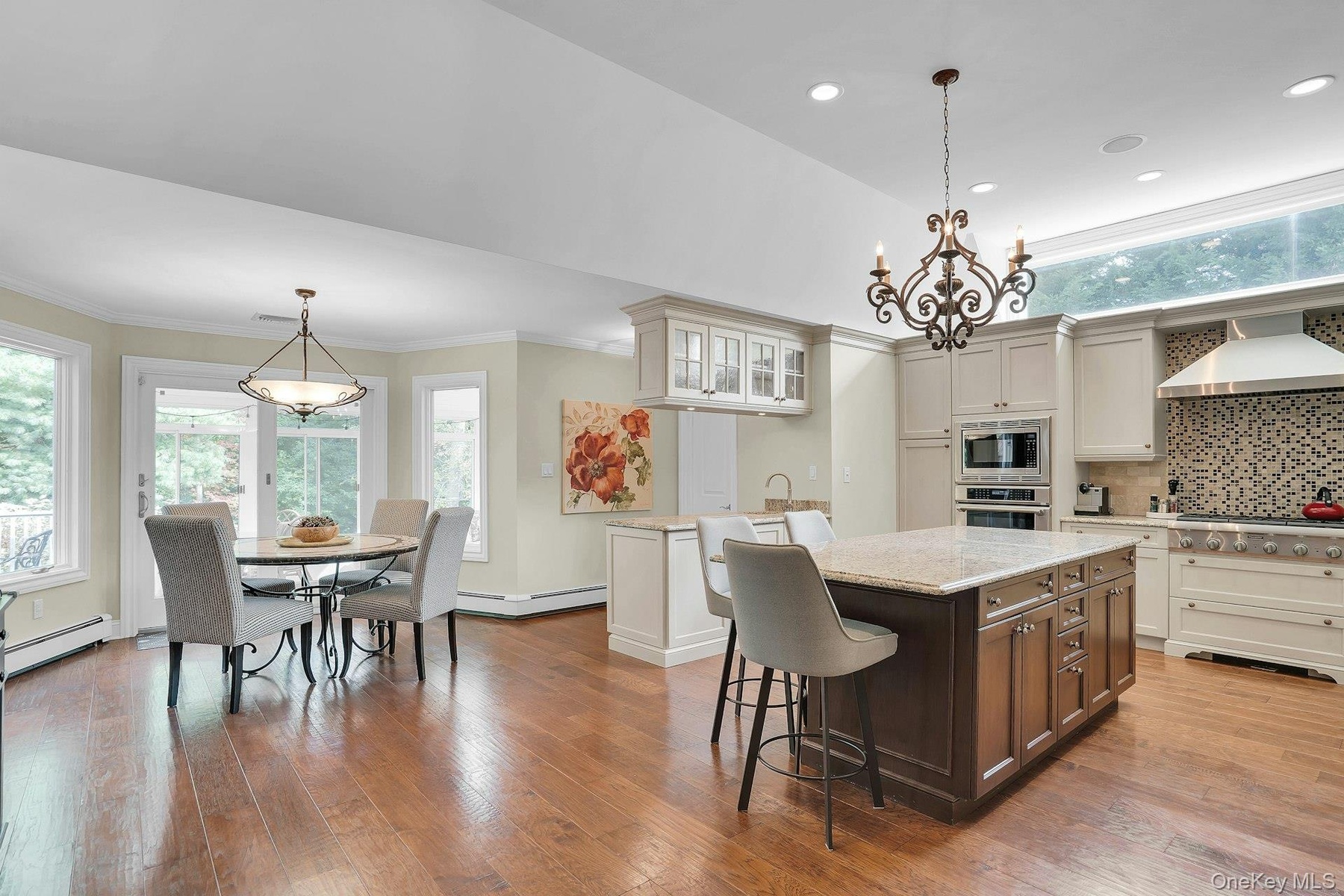 Soaring ceilings and engineered hardwood floors.