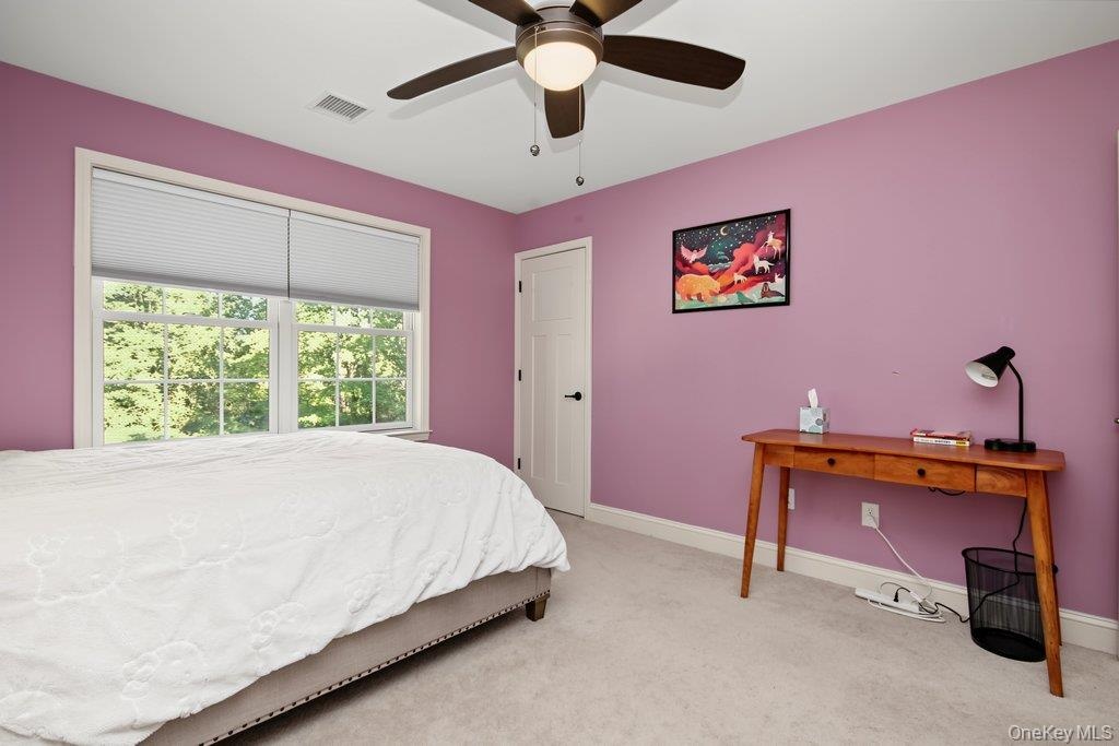white paneled door, and neutral-toned carpeting