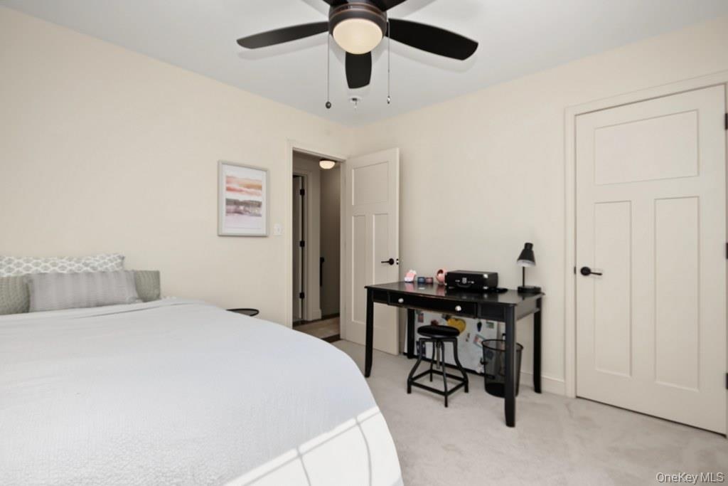 neutral wall color, two panel doors, black hardware