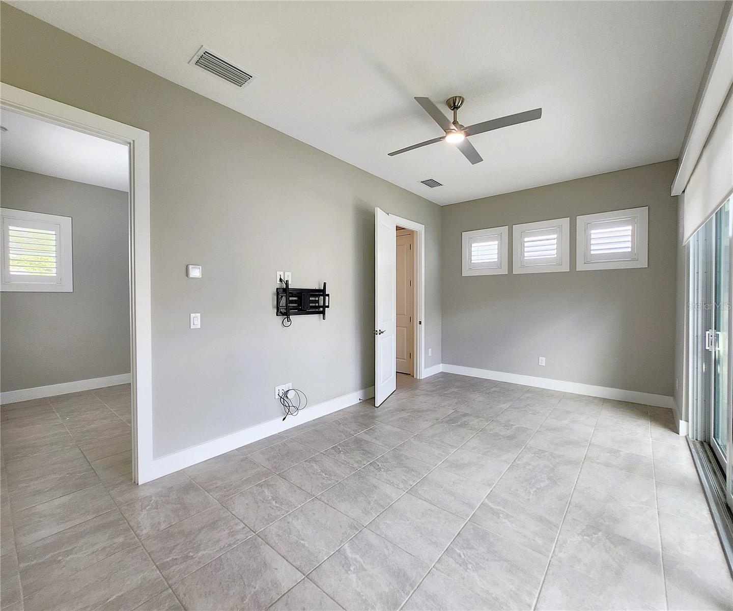 Guest House measures approximately 20x23, includes 1 bedroom, 1 full bathroom, living room, impact glass sliders with remote controlled shades.