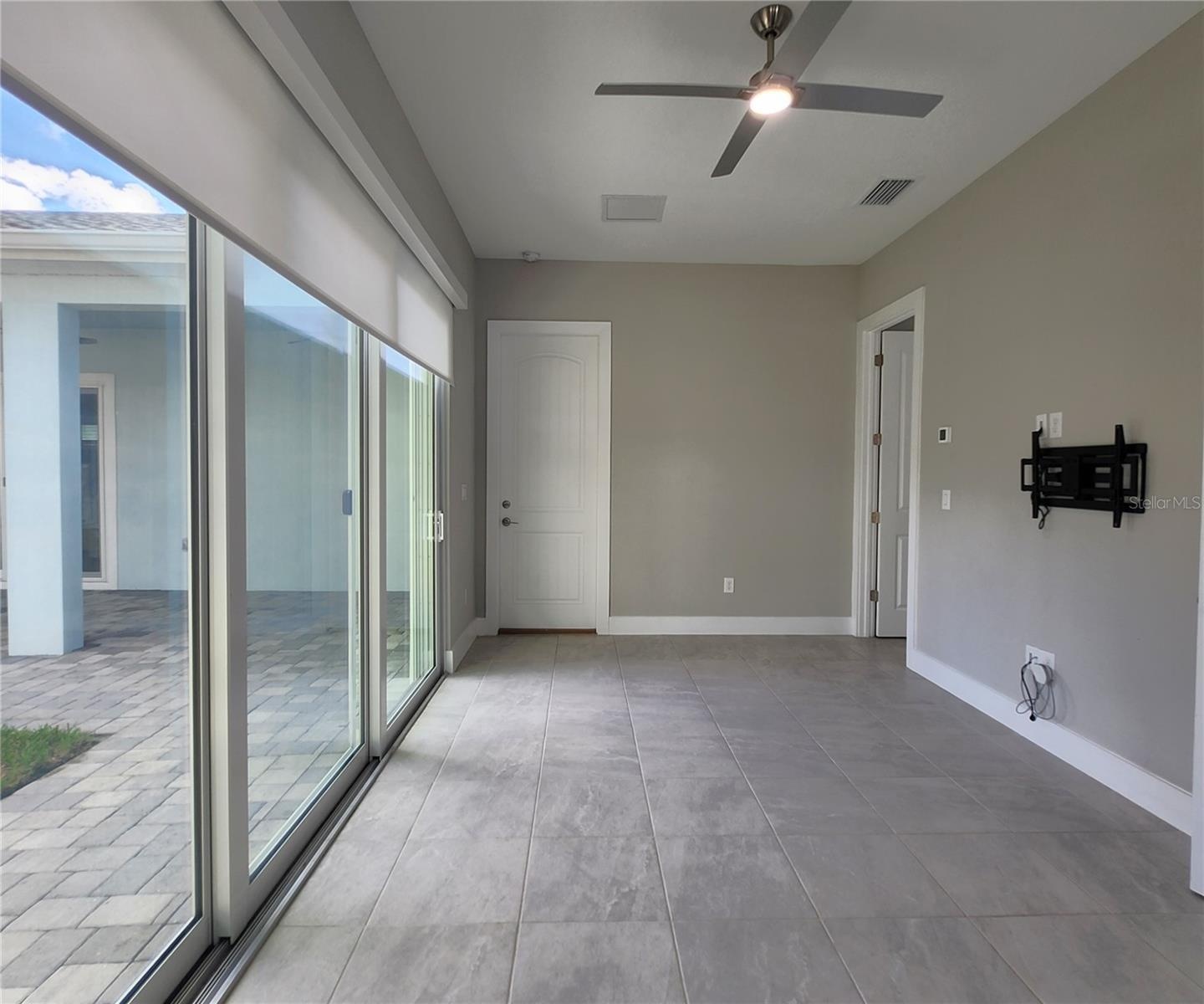 Guest House measures approximately 20x23, includes 1 bedroom, 1 full bathroom, living room, impact glass sliders with remote controlled shades.