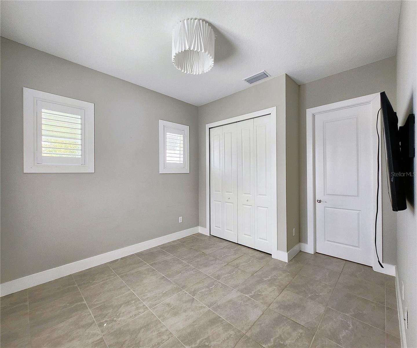 Guest House measures approximately 20x23, includes 1 bedroom, 1 full bathroom, living room, impact glass sliders with remote controlled shades.