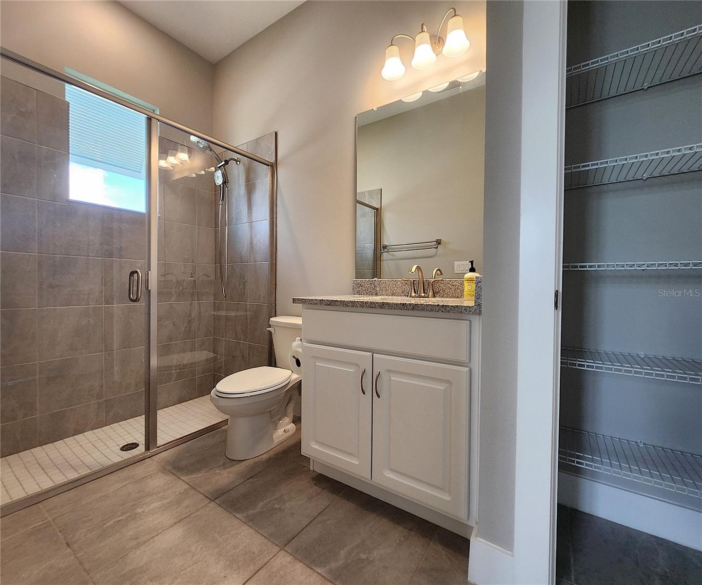 Guest House measures approximately 20x23, includes 1 bedroom, 1 full bathroom, living room, impact glass sliders with remote controlled shades.