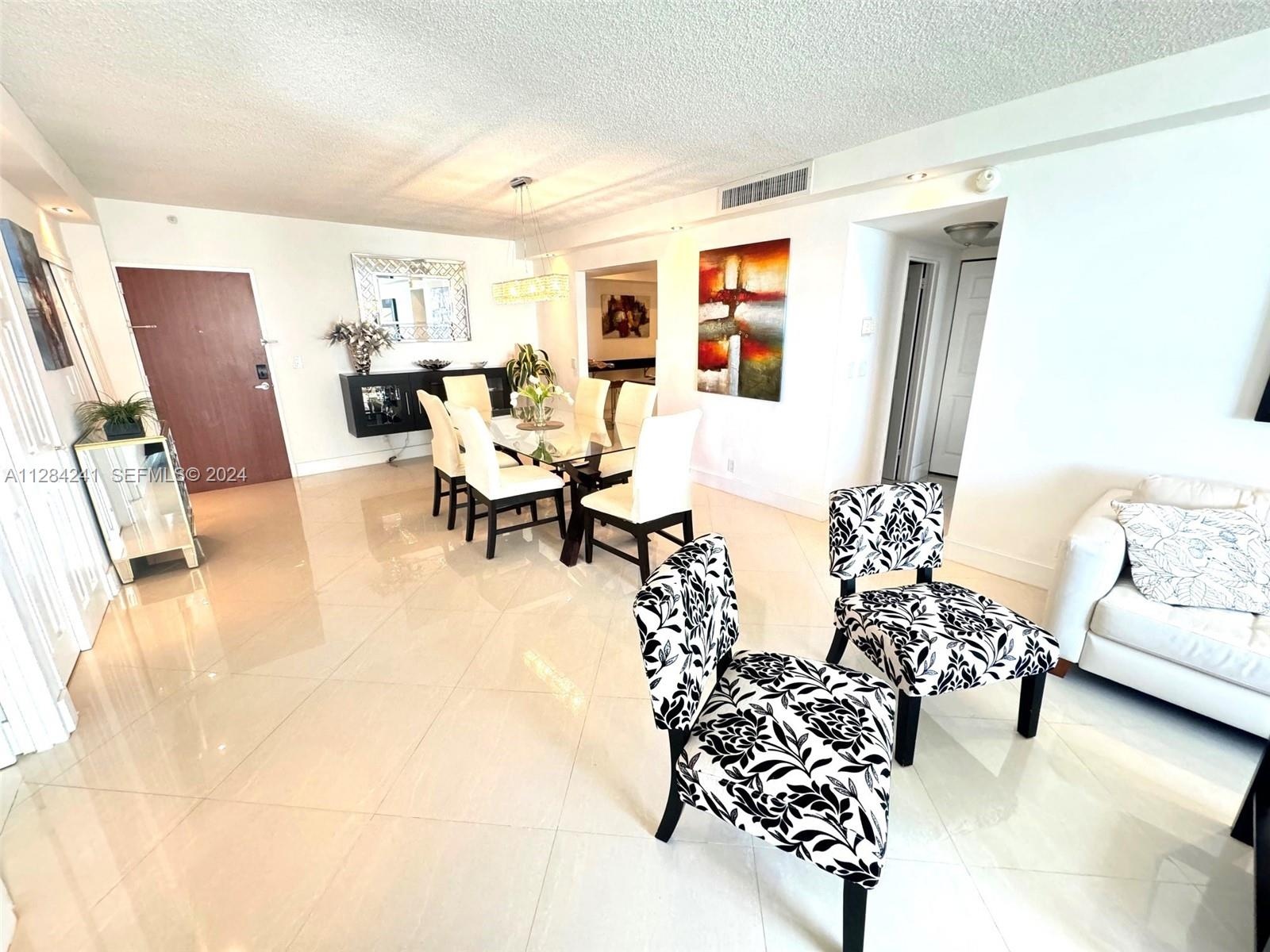 white leather sect sofa, Large Flat TV, upscale furnished