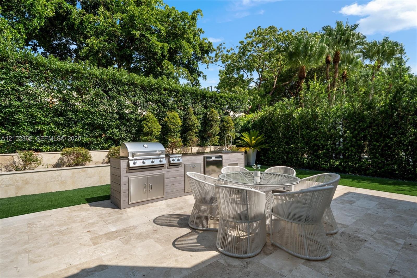 Exterior featuring a stucco facade, tile roof, swimming pool with stone decking, and an integrated putting green