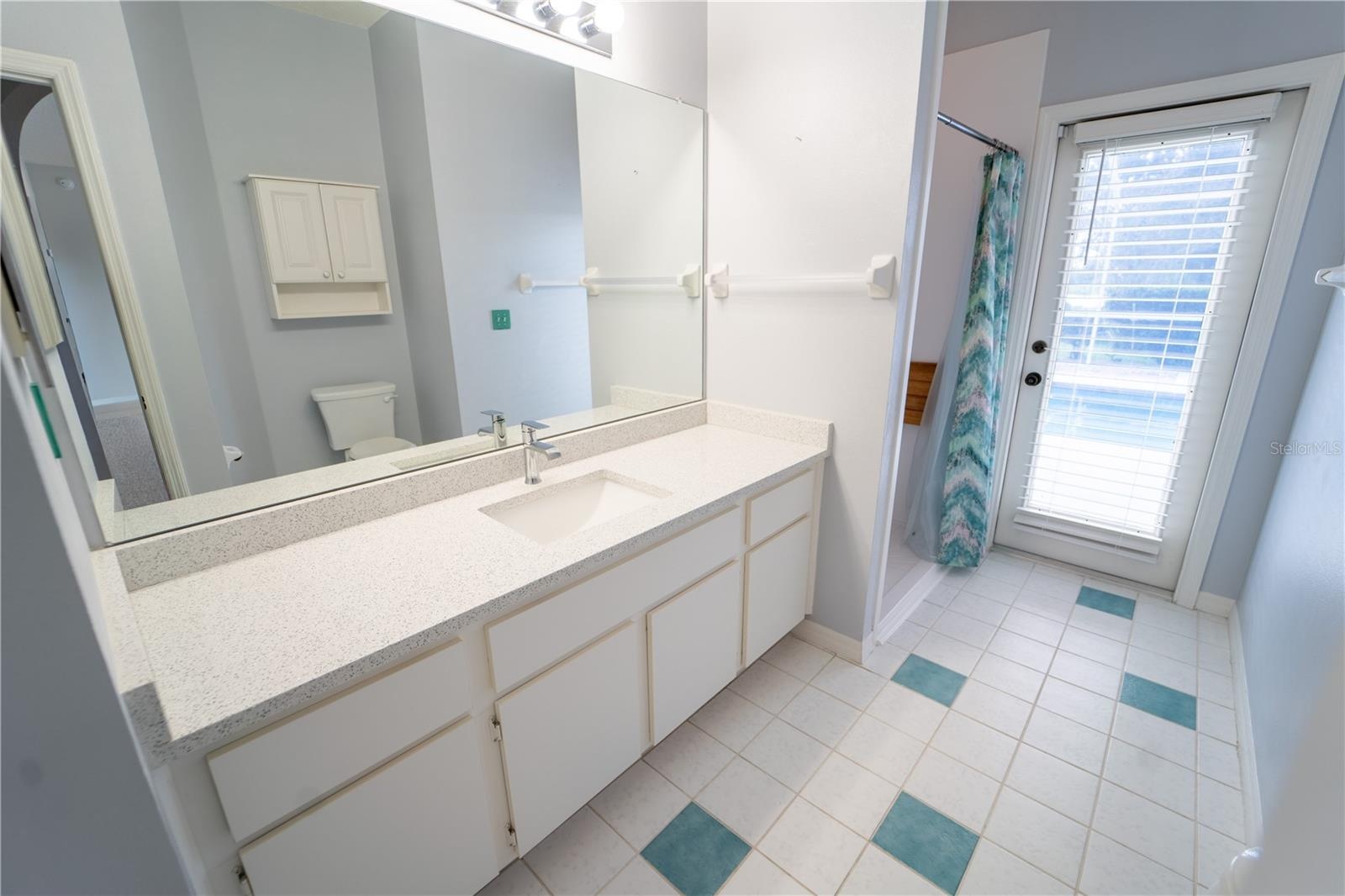 BATHROOM 3 ~ DOOR TO POOL AREA