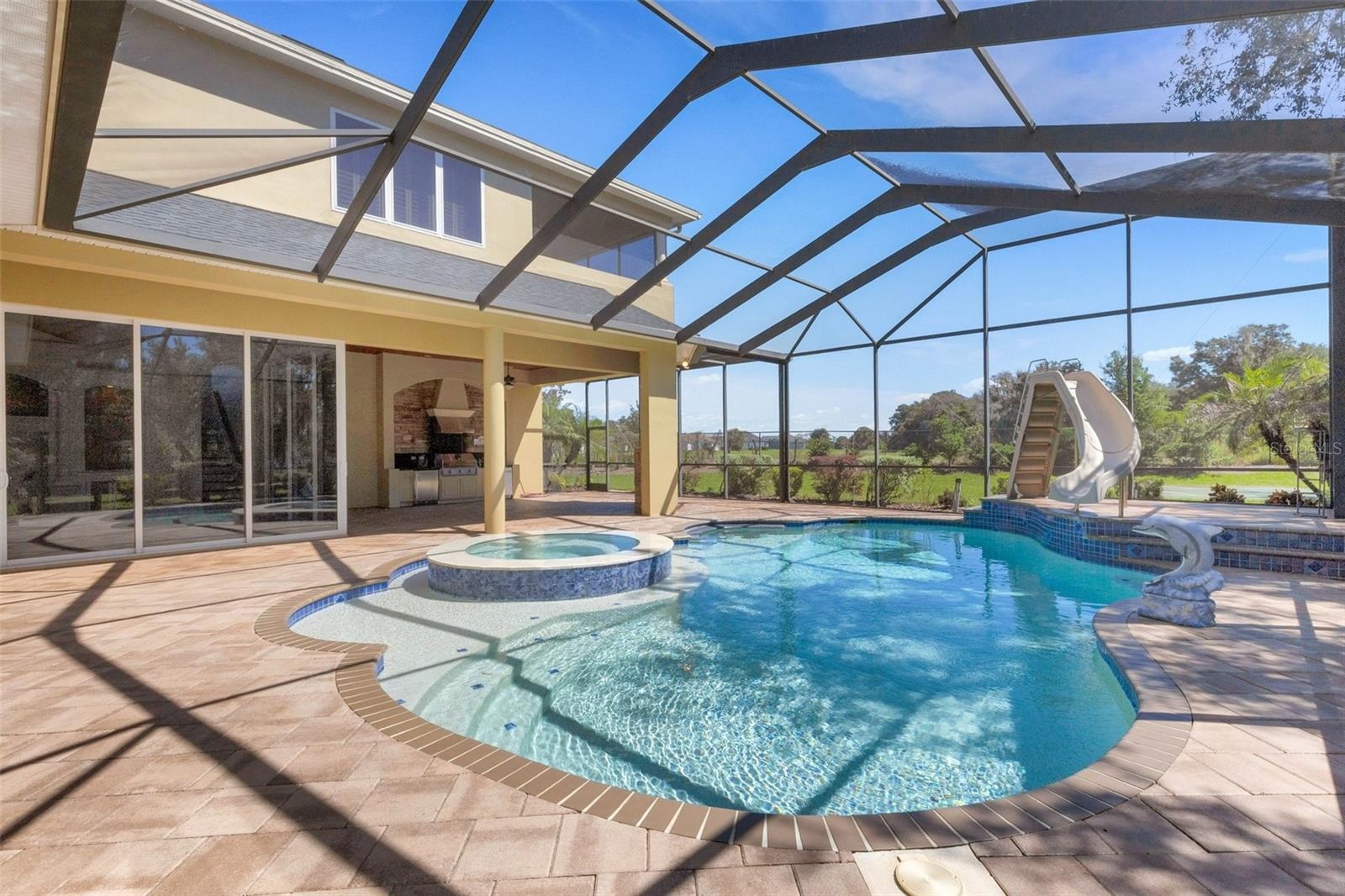 All completely screen enclosed with brick pavers all around.