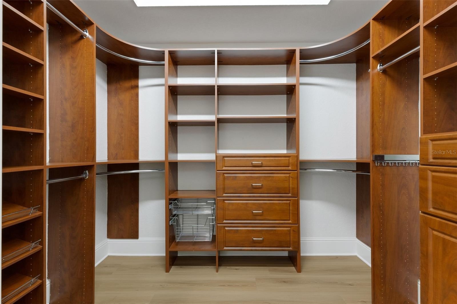 And the two oversized closets and outfitted with custom organizer systems . . .