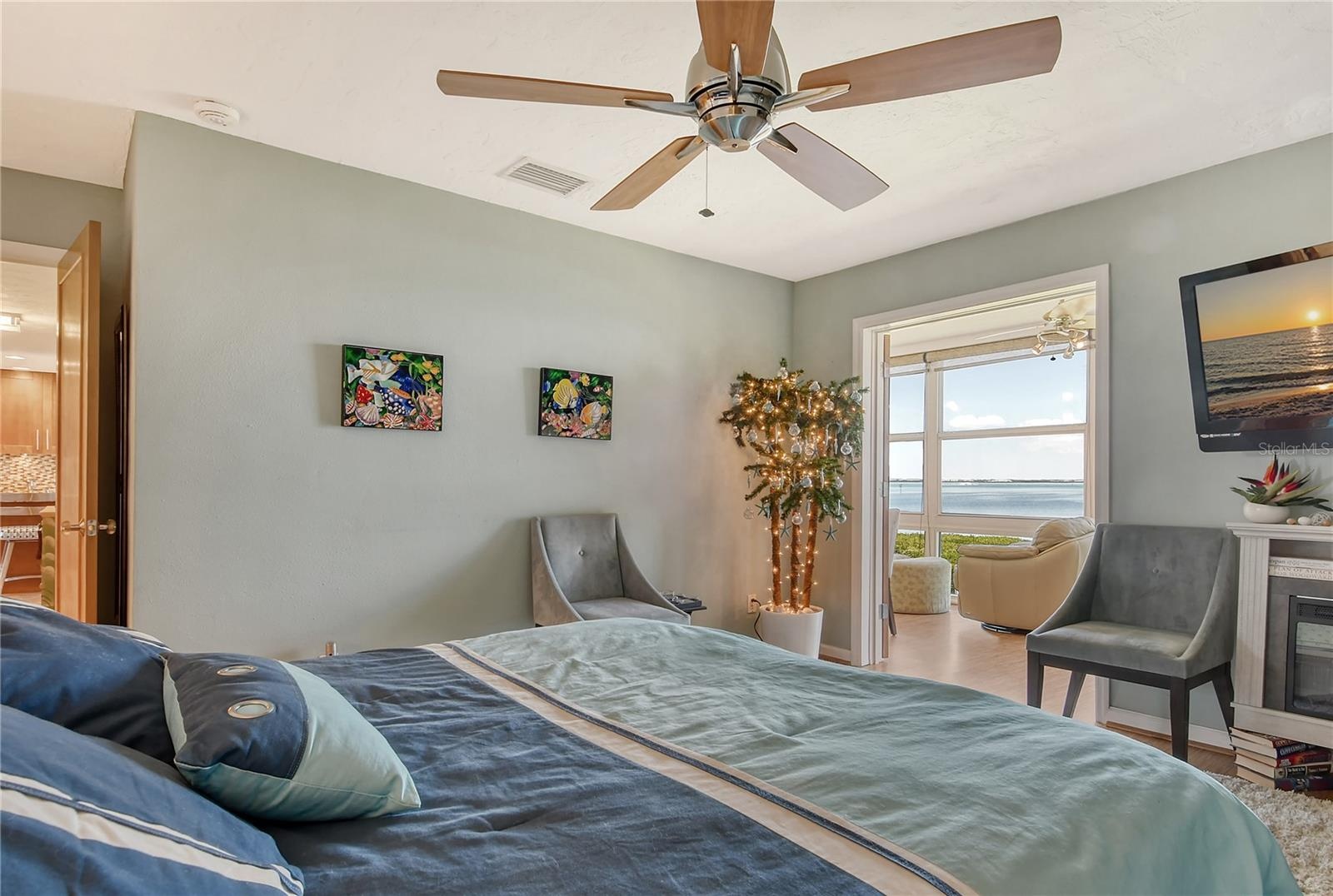 Primary Suite with Fireplace and Full Bayfront View!