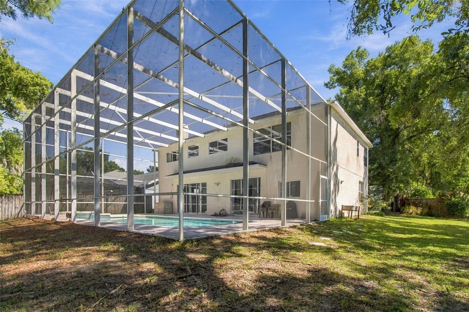 Screened in Patio Encompasses the house and pool