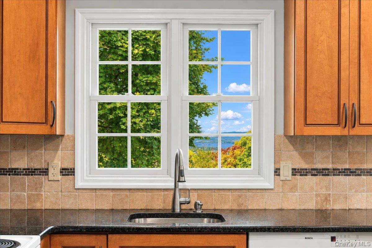 A kitchen window above the sink frames beautiful Hudson River views, making even everyday moments a little more scenic.